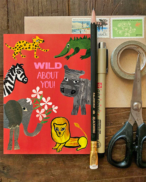 wild about you - greeting card on desk with tools. original collage artwork designed by denise fiedler for paste.